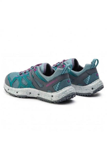 Pair of teal trail shoes with purple laces, side mesh panels, low-profile sole