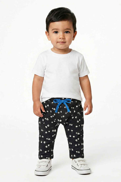 Dark navy baby pants with white eye print and blue waistband bow