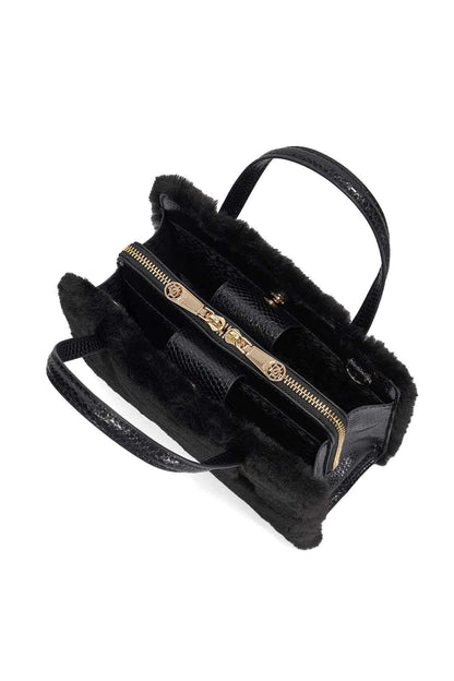 Dune London black faux-fur handbag with zip top and inner pockets, side angle