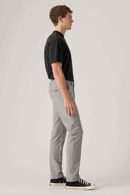 Men's grey jeans side view, slim-straight leg and button fly