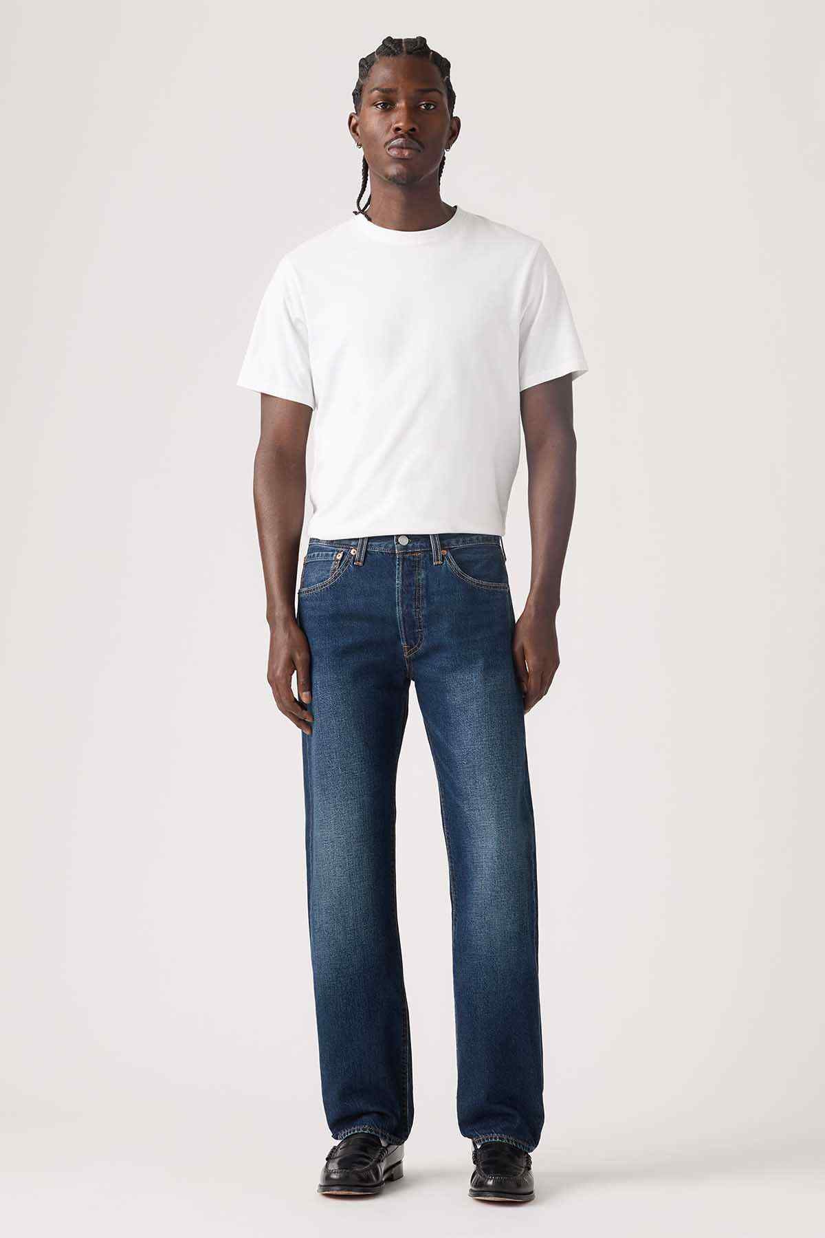 Dark wash denim jeans with straight legs, front button fly, and back pockets
