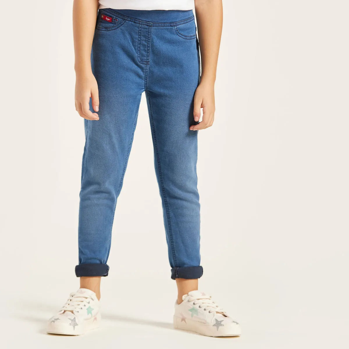 Blue denim baby jeans with front button fly, belt loops, cuffed hems