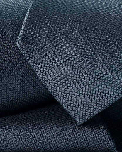 Charles Tyrwhitt blue necktie close-up, fine grid weave texture