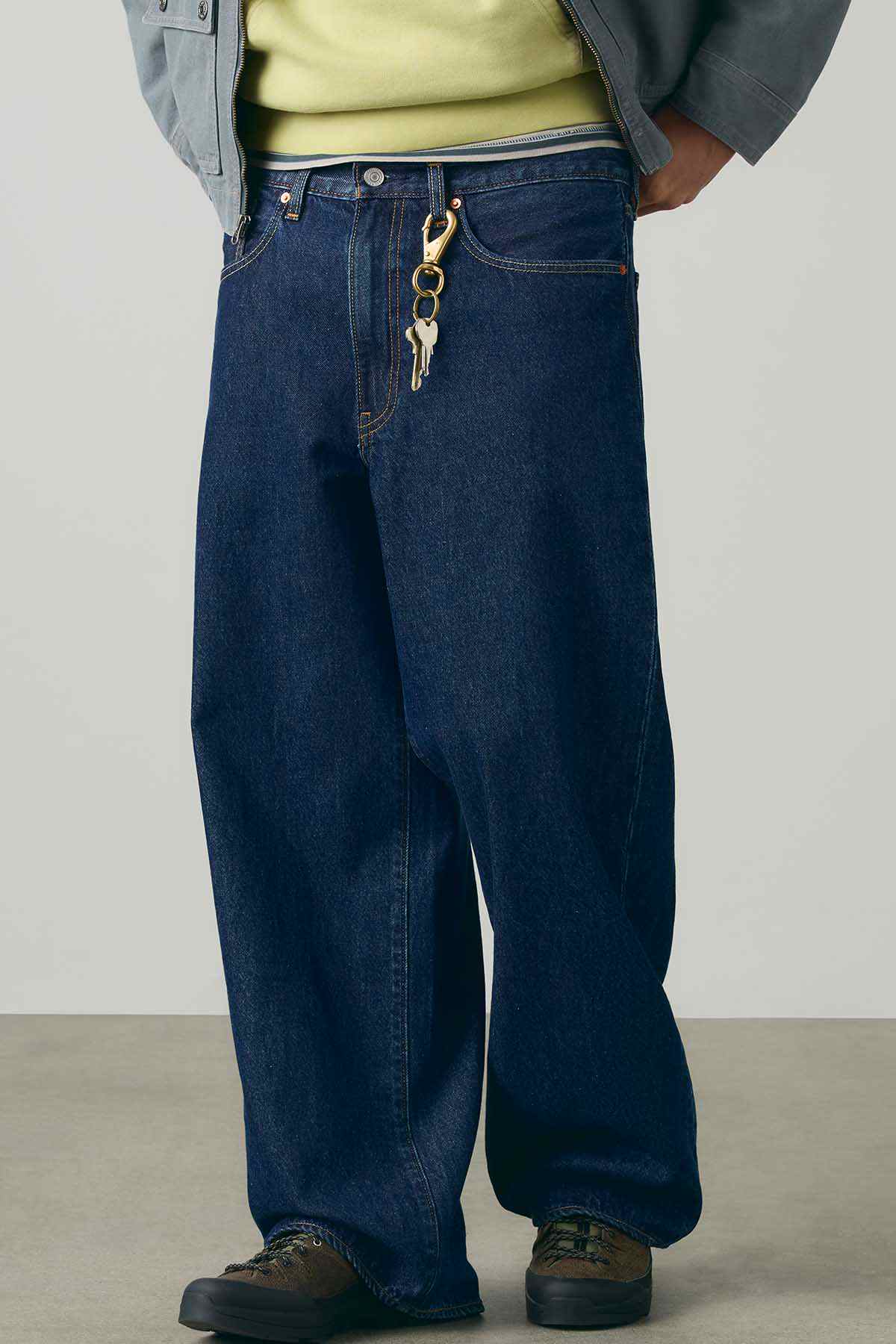 Dark wash denim jeans with coin pocket and hanging chain detail