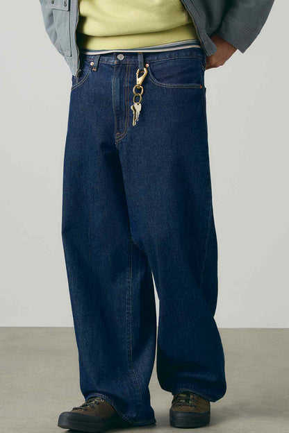 Dark wash denim jeans with coin pocket and hanging chain detail