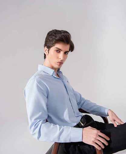 Light blue fitted button-up shirt with spread collar, long sleeves, and button placket.