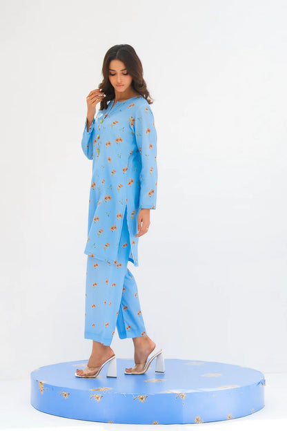 Women's light blue floral printed kurta and pants set, side view with 3/4 sleeves