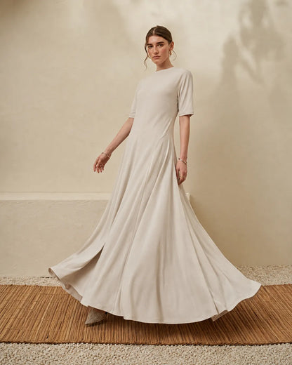 Beige crew-neck maxi dress with short sleeves and flared hem, full length