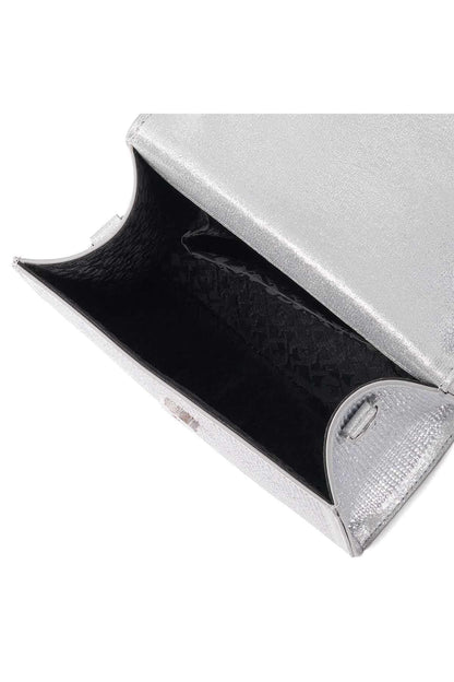 Silver mini handbag interior with black lining and metal clasp at opening