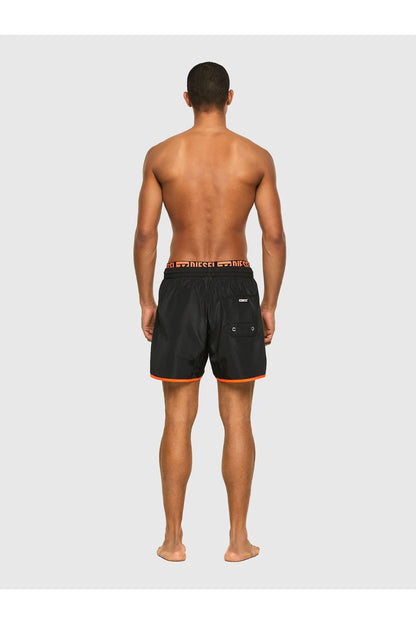 Diesel black swim shorts, orange-trimmed hem and logo waistband, back view
