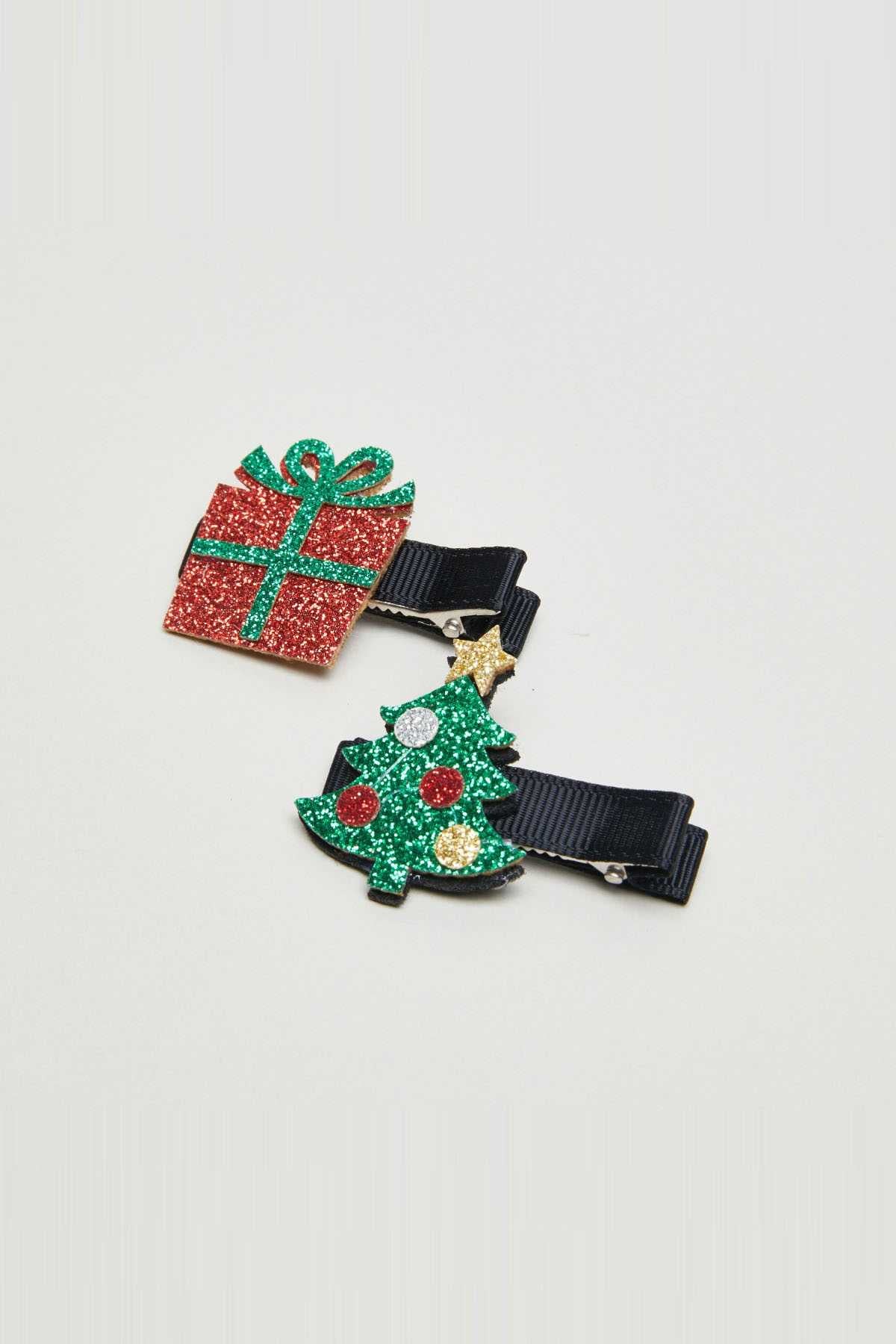 Set of two glitter Christmas gift hair clips with ribbon bows on dark blue clips