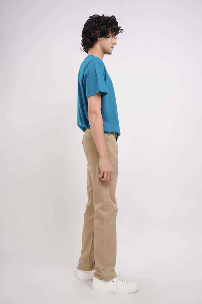 Khaki straight-leg pants in side profile with belt loops