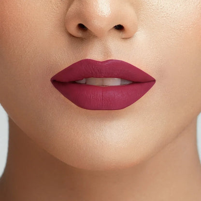 Rose-pink velvet lipstick on close-up lips with soft matte sheen