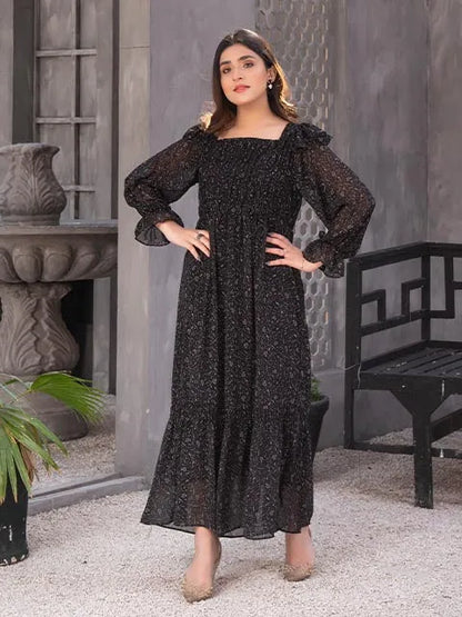 Nazmina black maxi dress with wide puff sleeves and flowing hem