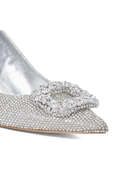 Silver rhinestone bow detail on pointed-toe pump, close-up