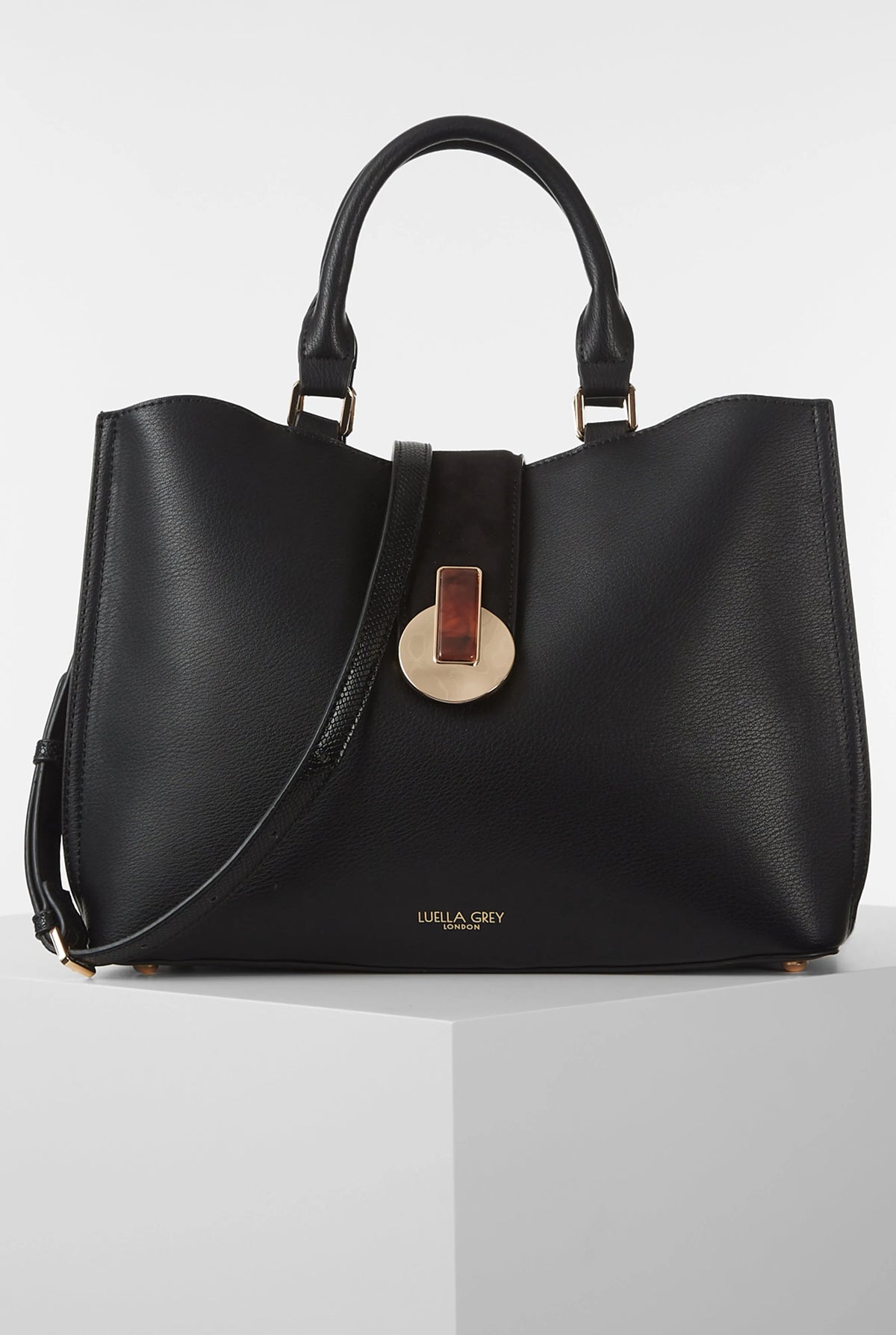 Black leather-look tote bag with top handles and center strap detail