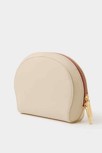 Cream half-moon pouch bag with side zip edge and gold zipper pull