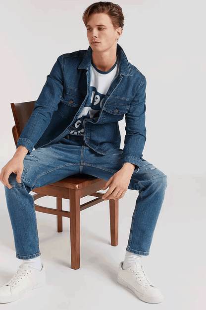 Men's blue denim jeans with straight leg, distressed rips, five-pocket styling