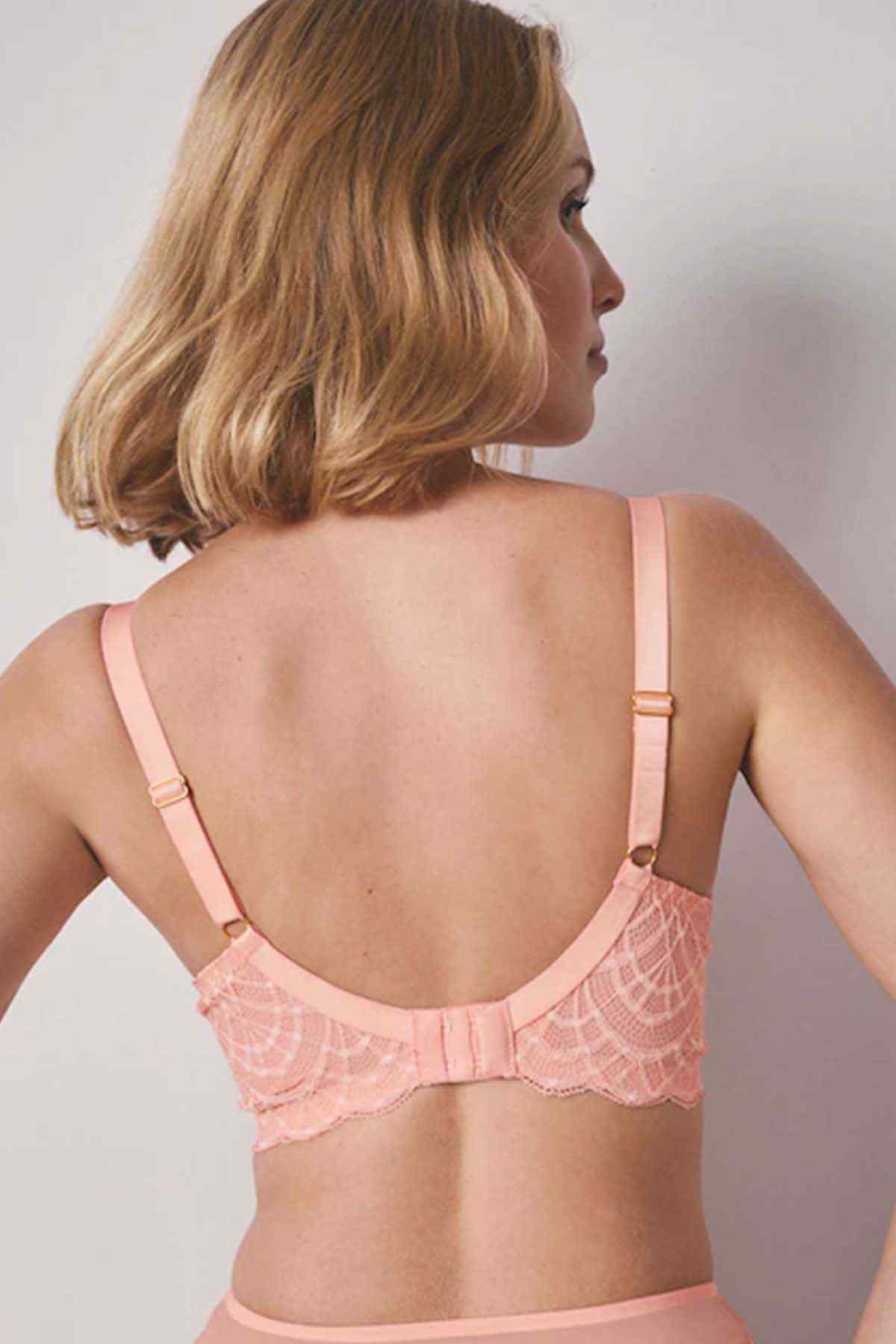 Coral pink lace bra with adjustable straps and open back detail.