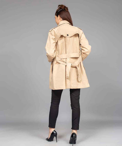 Tan trench coat rear view with tied waist belt and flap collar