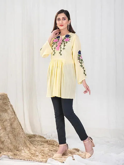 Women’s yellow embroidered tunic with pink and navy floral front, round neckline