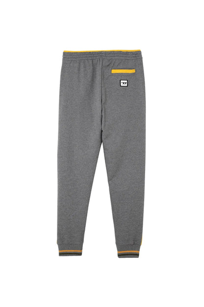 Grey Diesel jogger pants with yellow waistband, side stripe accents, logo label at thigh.