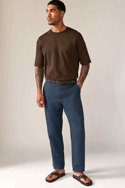 Men's navy straight-leg jeans with mid-rise waist and stitched belt loops