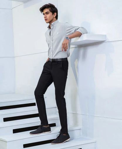 Light blue button-up dress shirt with long sleeves and buttoned front, modern fit