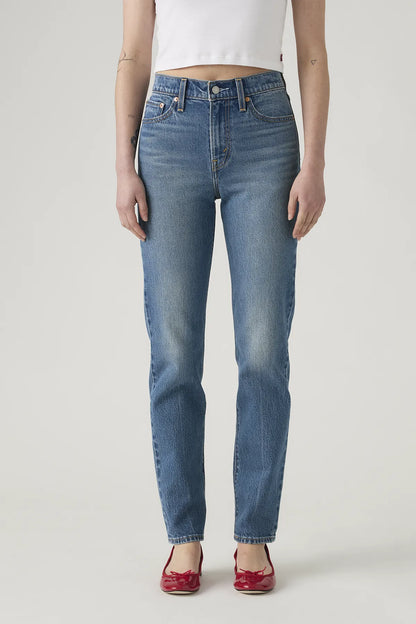 Levi's women's medium indigo straight-leg jeans with front button and five-pocket styling