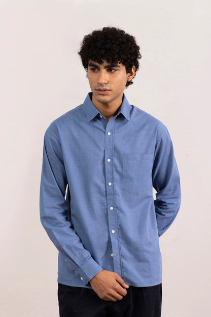 Men's blue button-up shirt with long sleeves, chest pocket, and button-front closure