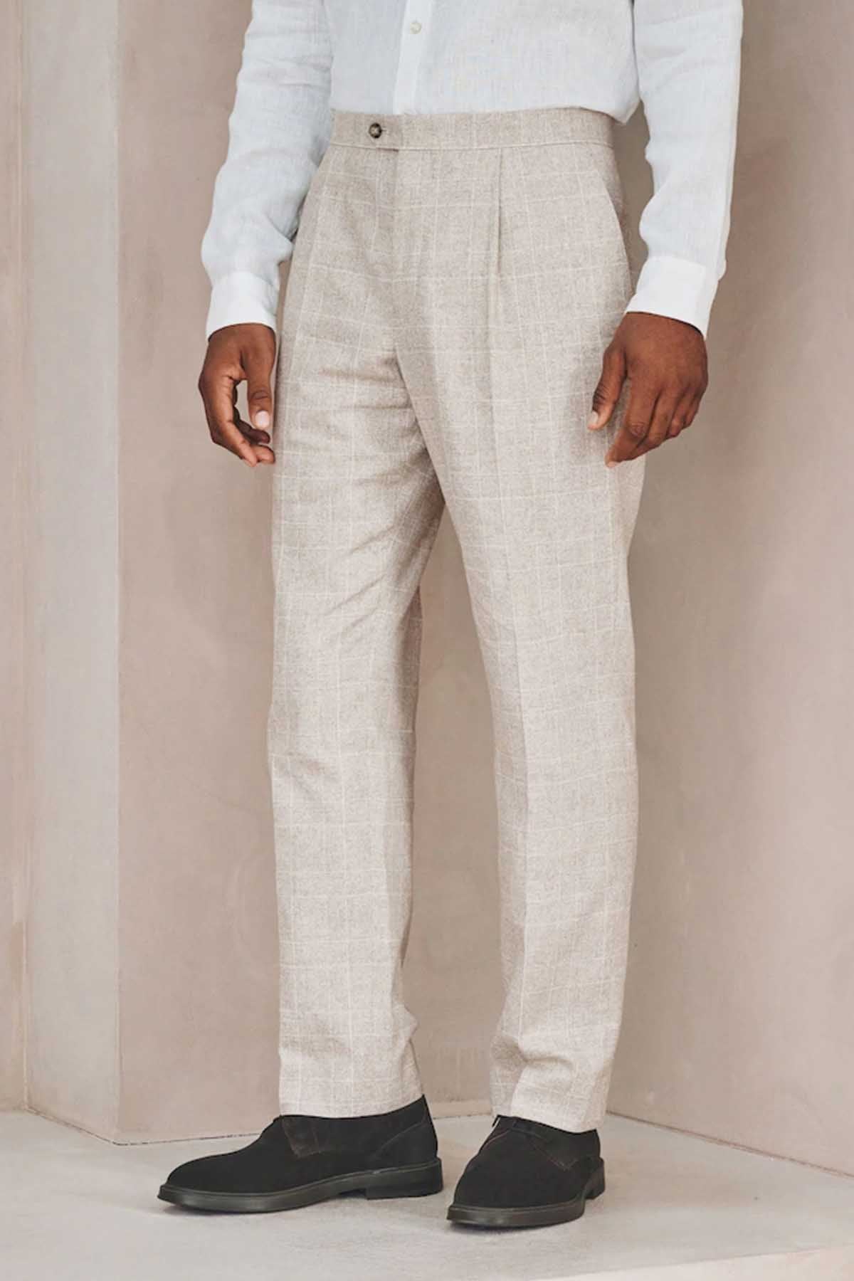 Men's light beige suit trousers with belt loops and side seam details