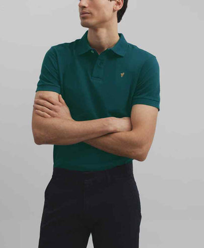 Fitted teal polo shirt with button placket and small chest logo