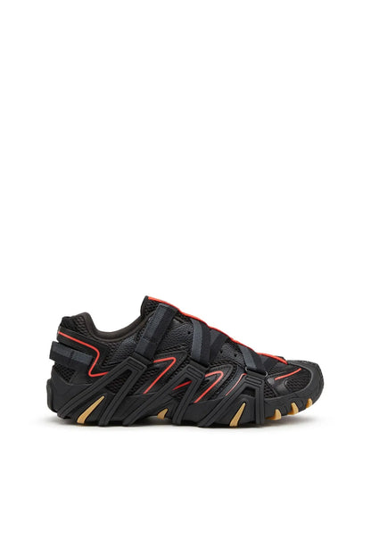 Black sport sneakers with red accents and chunky tread sole