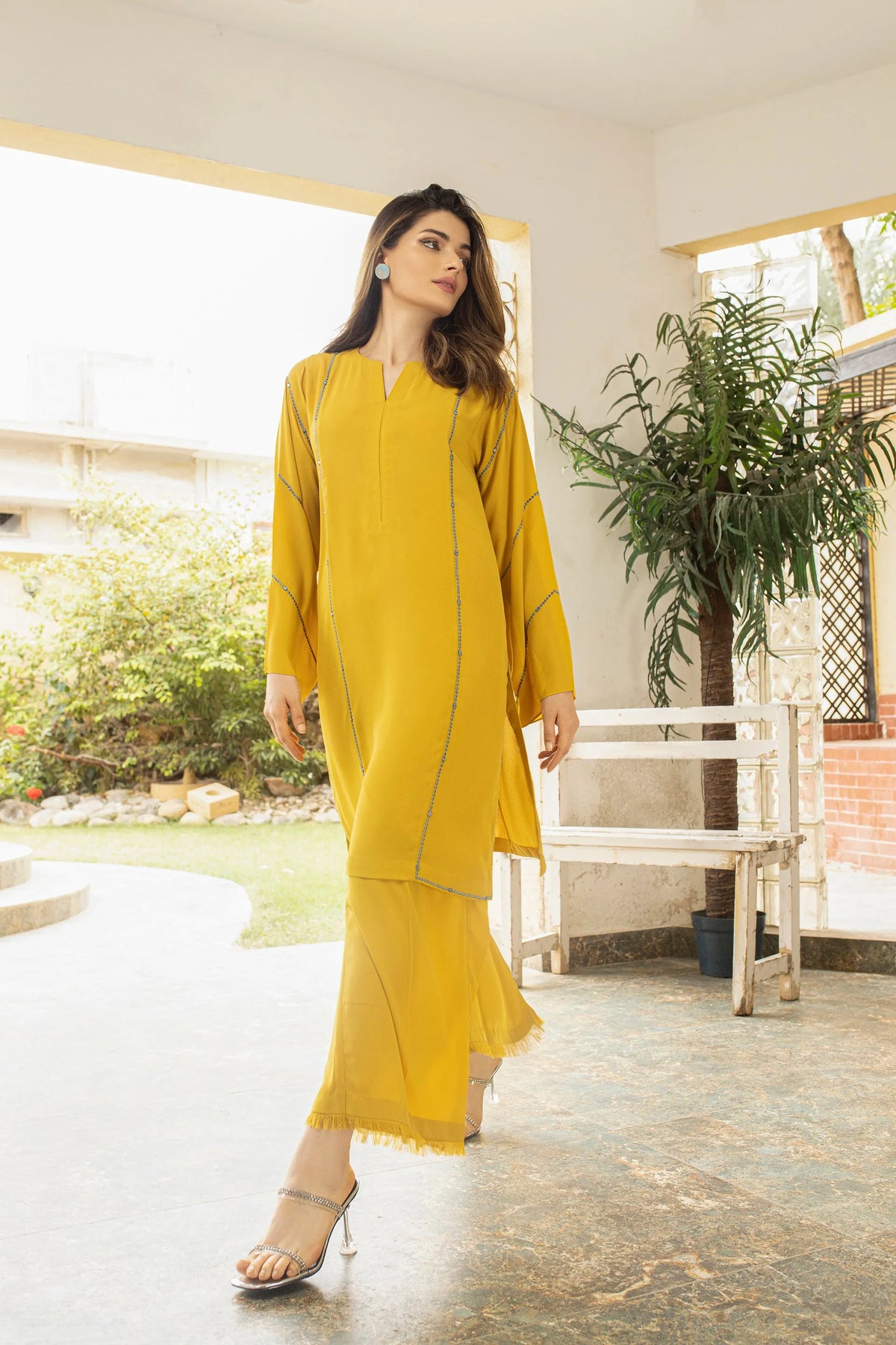 Lime yellow velour long tunic with matching flowing pants, side view