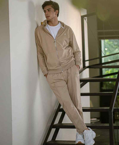 Beige zip-up hoodie with hood and front zipper; matching jogger pants set