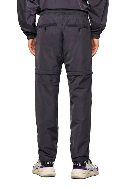 Dark navy pants with multiple flap pockets and elastic ankle cuffs
