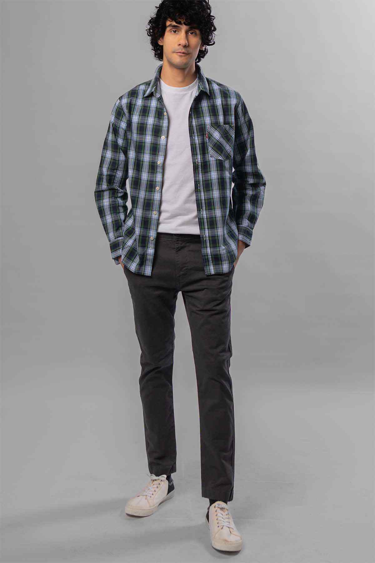 Men's dark grey jeans, worn with a white T-shirt and plaid overshirt