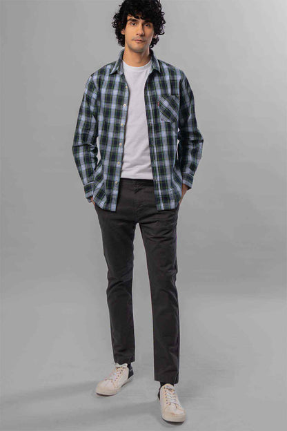 Men's dark grey jeans, worn with a white T-shirt and plaid overshirt