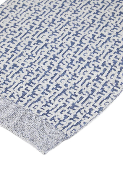 Blue and white logo knit scarf fabric close-up with ribbed knit texture