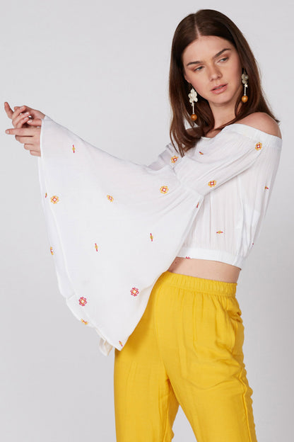 White off-shoulder embroidered crop top with flowy long sleeves