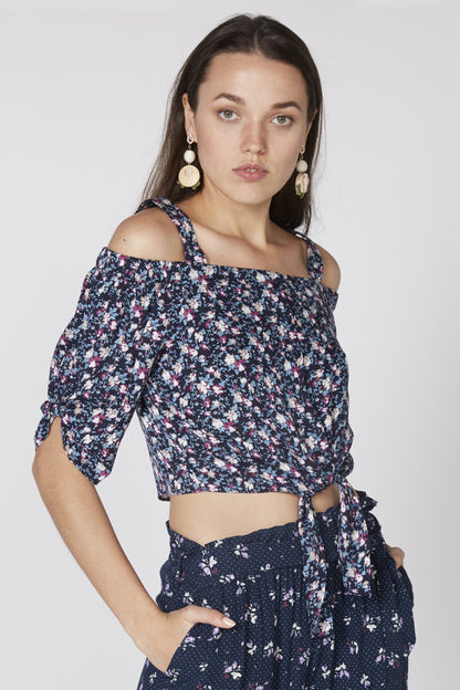 Floral off-shoulder crop top with navy base, short sleeves, and waist tie