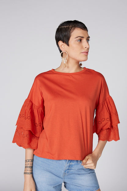 Orange loose-fit blouse with short sleeves and eyelet lace trim