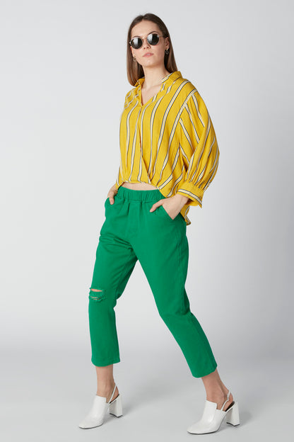 Splash striped blouse side view with elastic waist; green cropped pants