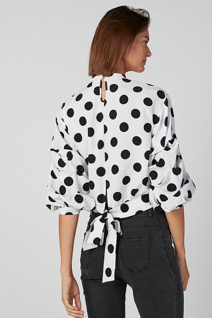 White polka-dot tie-back blouse with puff sleeves, back view