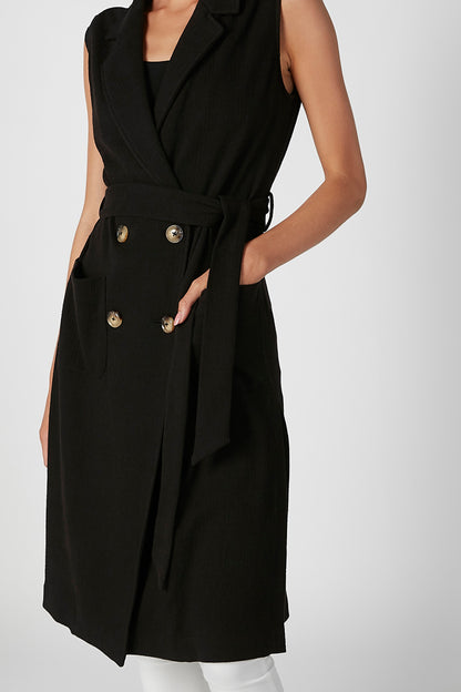 Black sleeveless vest with lapels and gold button front, belted waist wrap detail