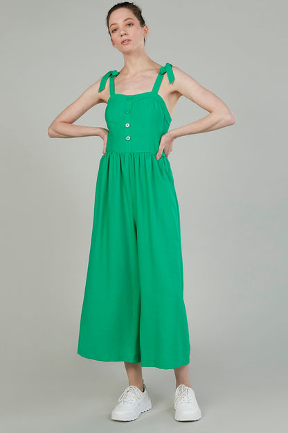 Green sleeveless midi dress with gathered waist, tie shoulder straps and button detail