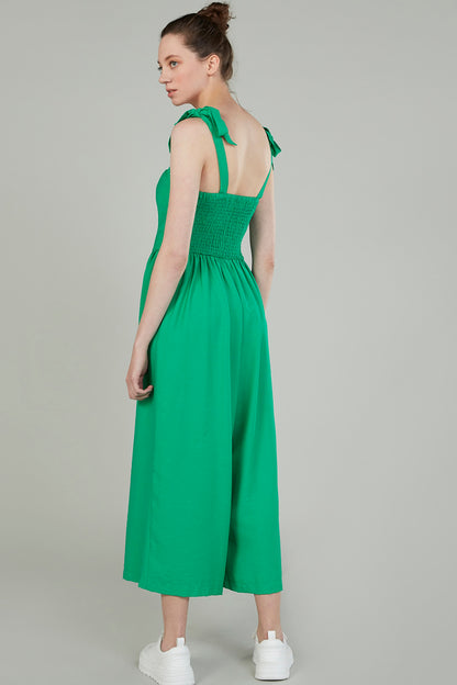 Green sleeveless midi dress with tie straps at back, gathered waist and button front