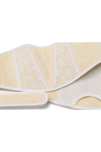 Cream support belt with embroidered lace stripes and textured side mesh.