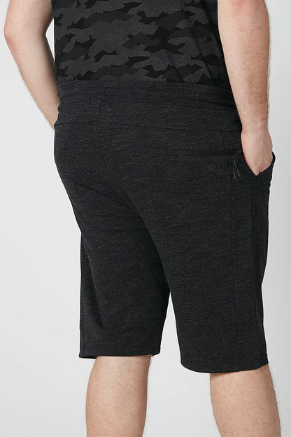 Black heather knit shorts close-up with drawstring and stitched seams
