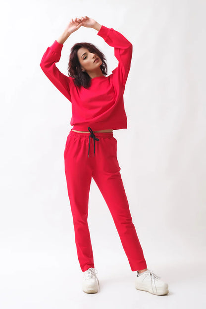 Red tracksuit set with drawstring waist joggers and long-sleeve sweatshirt, raised arms